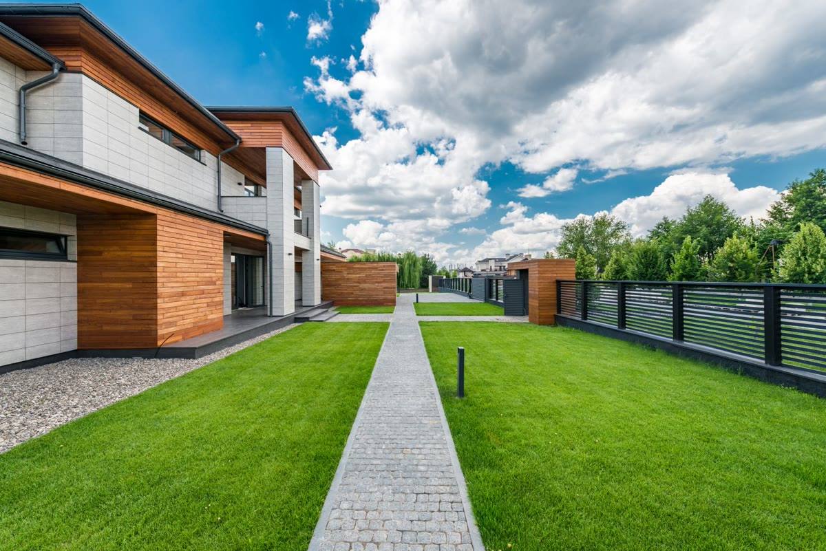 Modern black metal fence in front of a home