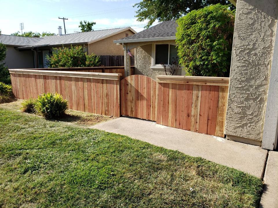 Redwood fence with a custom gate built by Build Rite