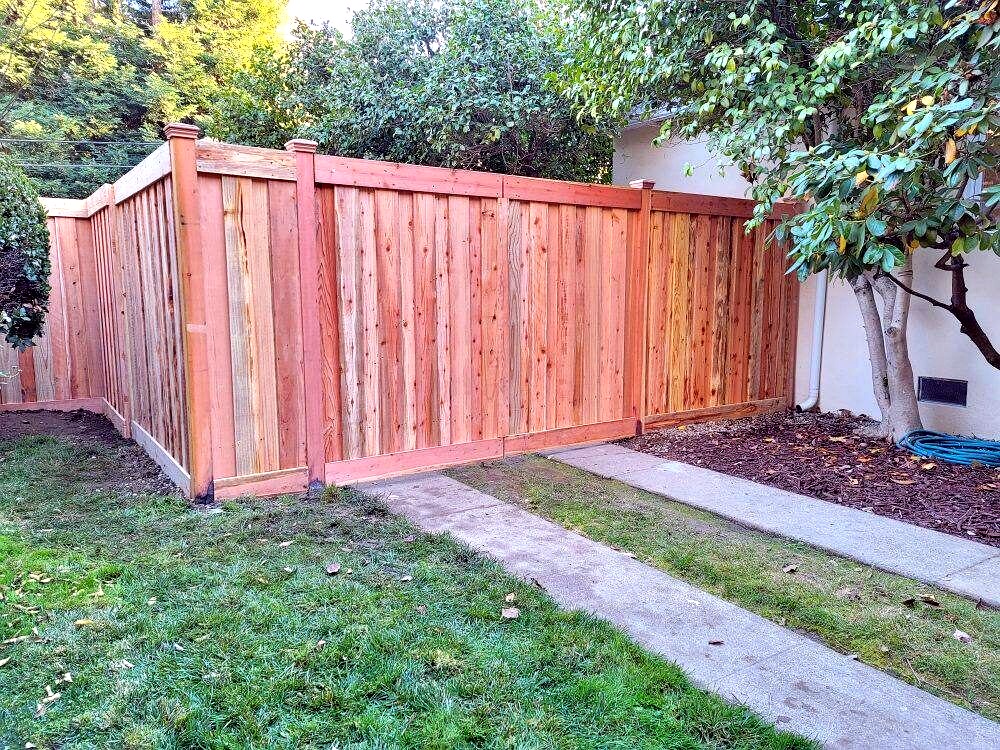 Close-up of a sturdy horizontal wood fence with bolted boards
